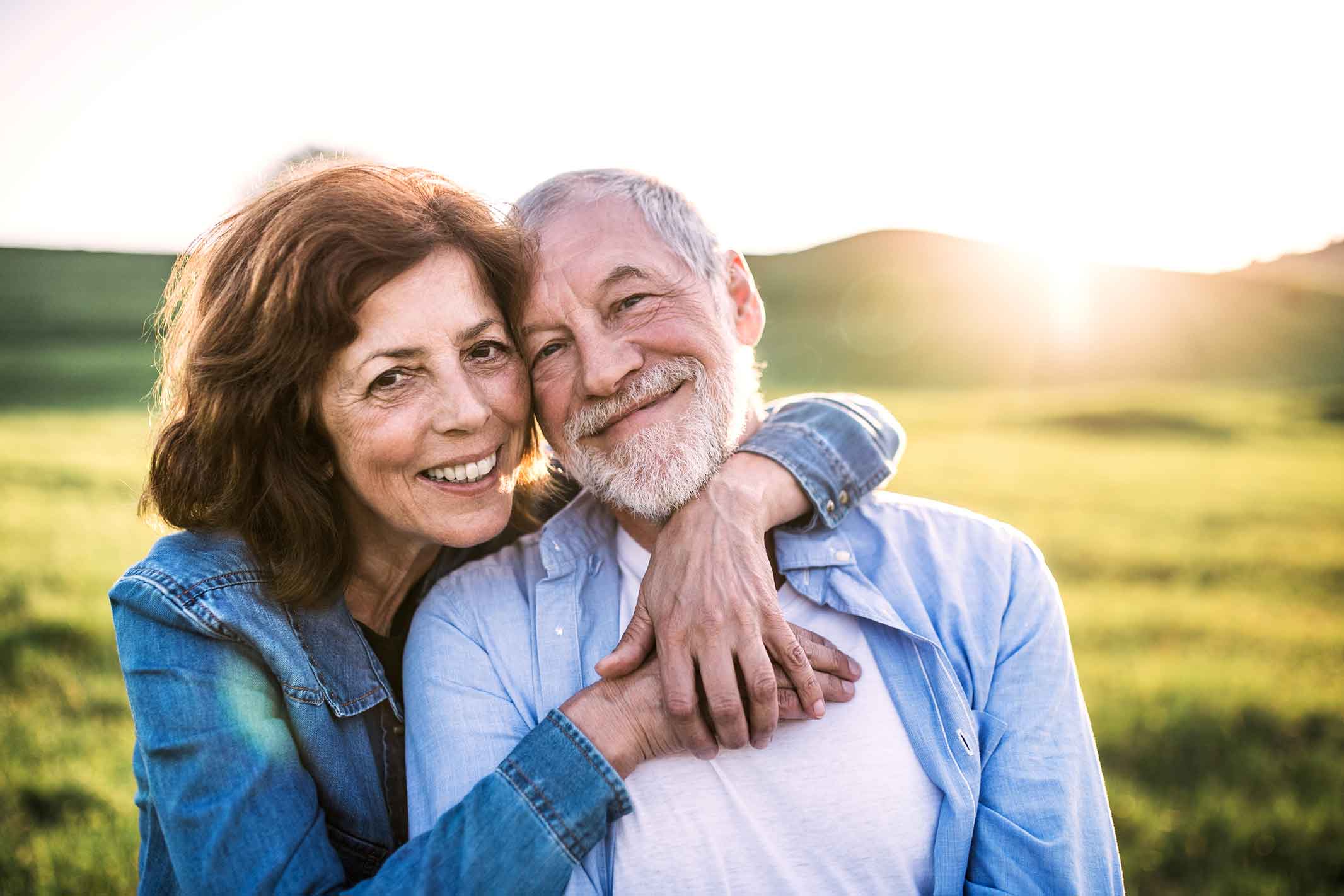 photo of smiling, embracing man and woman