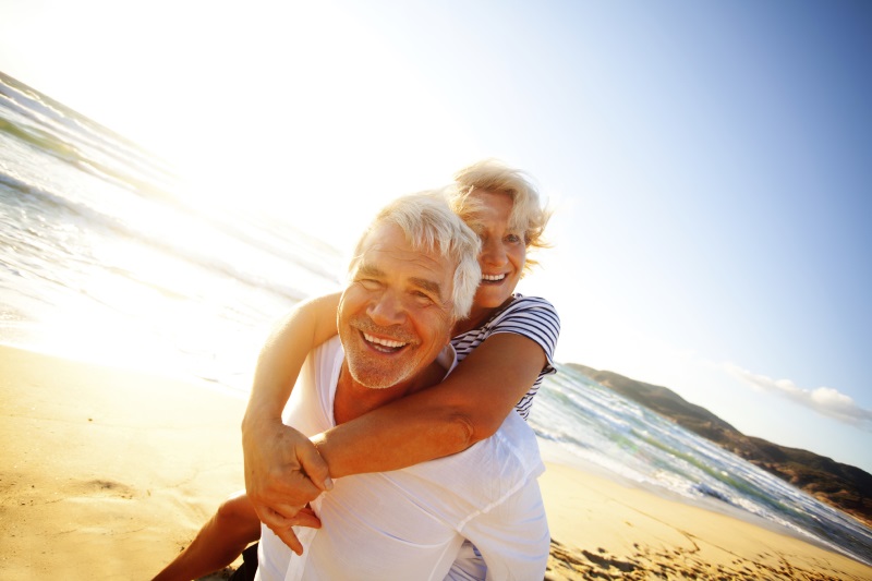 photo of woman with arms around man